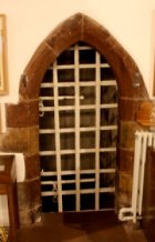 iron gate to vaulted chamber